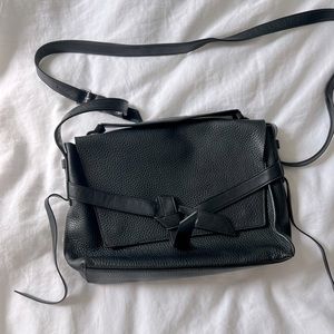 AllSaints Black leather crossbody snap purse. Moderate wear, good condition.
